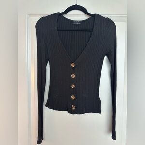 VICI black long sleeved shirt with brown buttons.